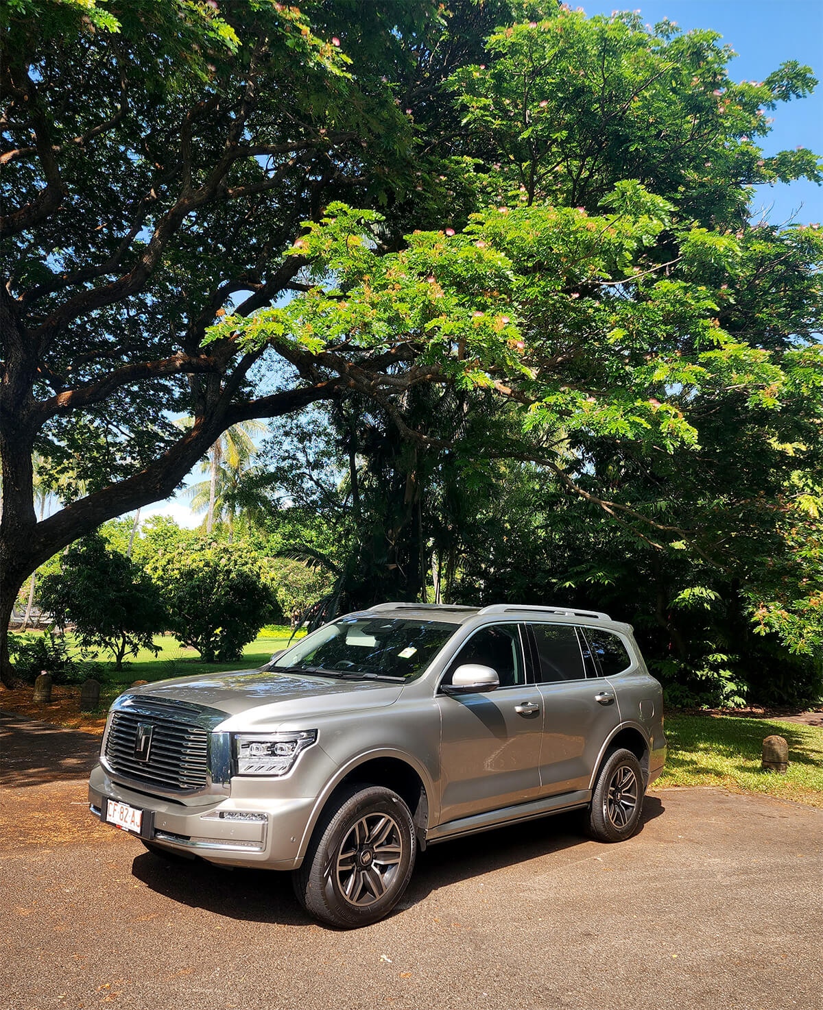 GWM Tank parked in front of trees