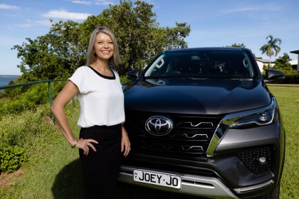 Smiling women with her new car