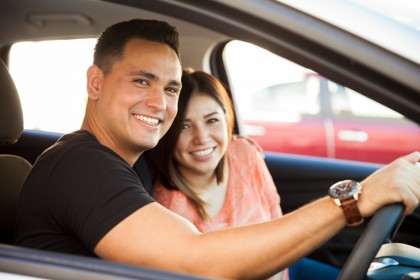 Couple driving in their car