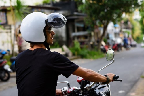 Man riding a motorbike in Asia